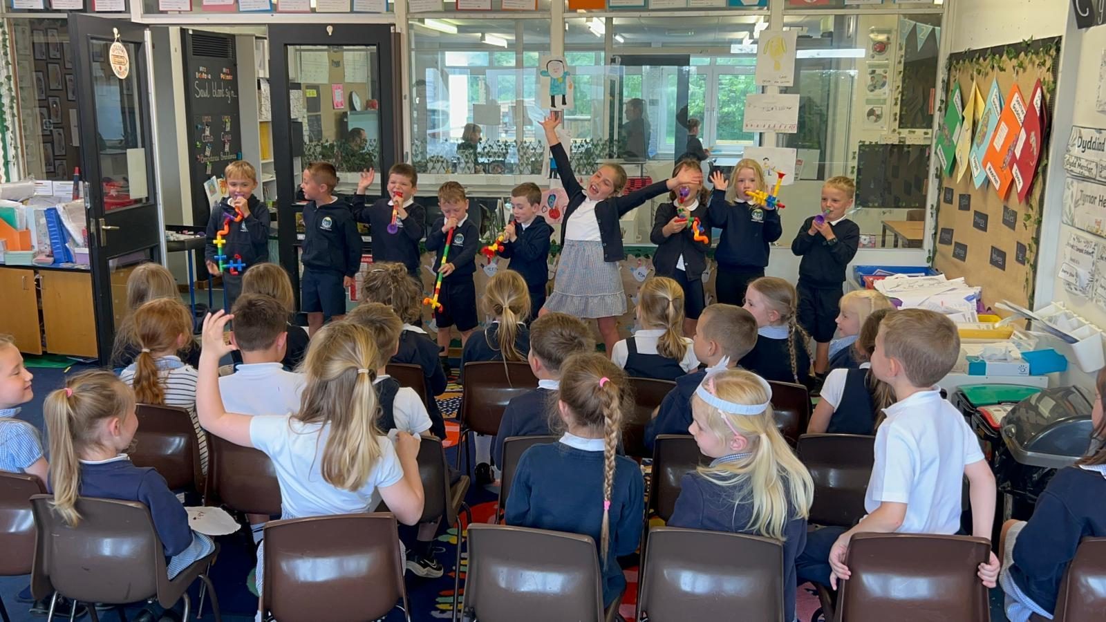 Pupils presenting a classroom performance