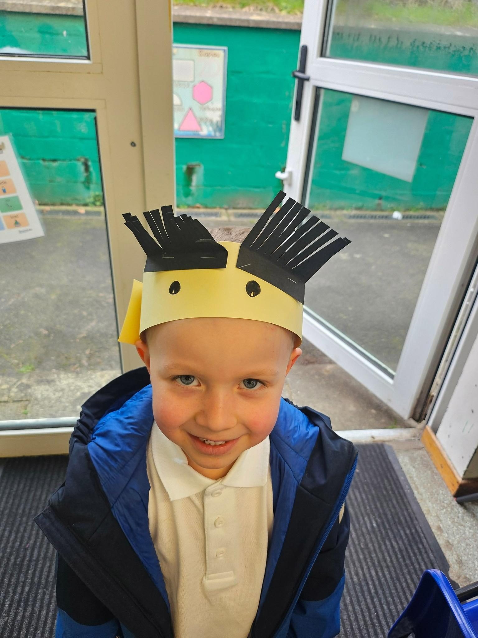 Pupil wearing a handmade crown