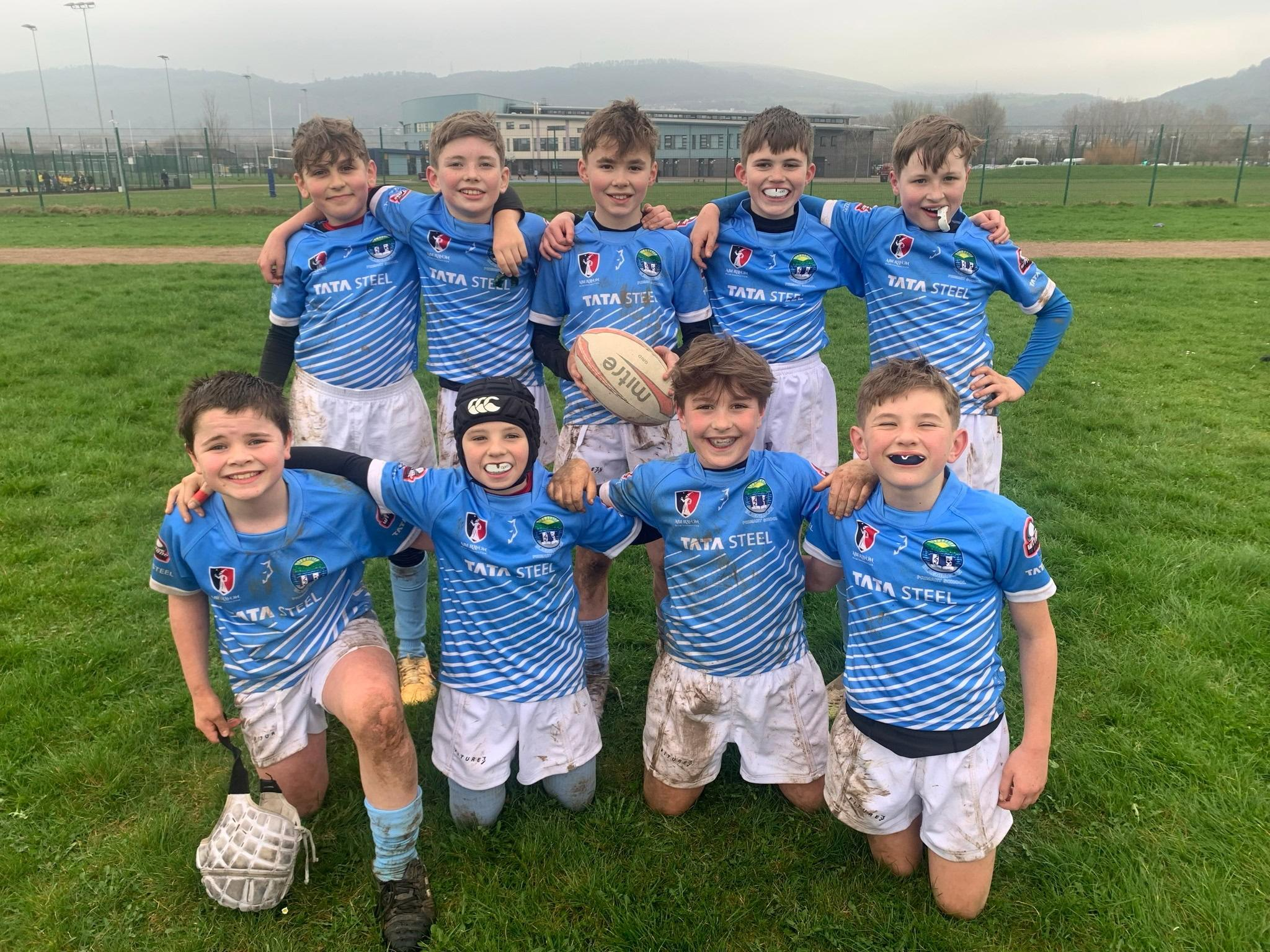 Pupils playing rugby together