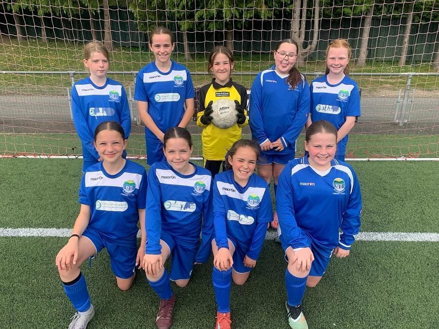 Pupils posing in their football kit