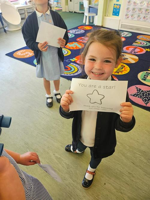 Pupil proudly sharing a star award