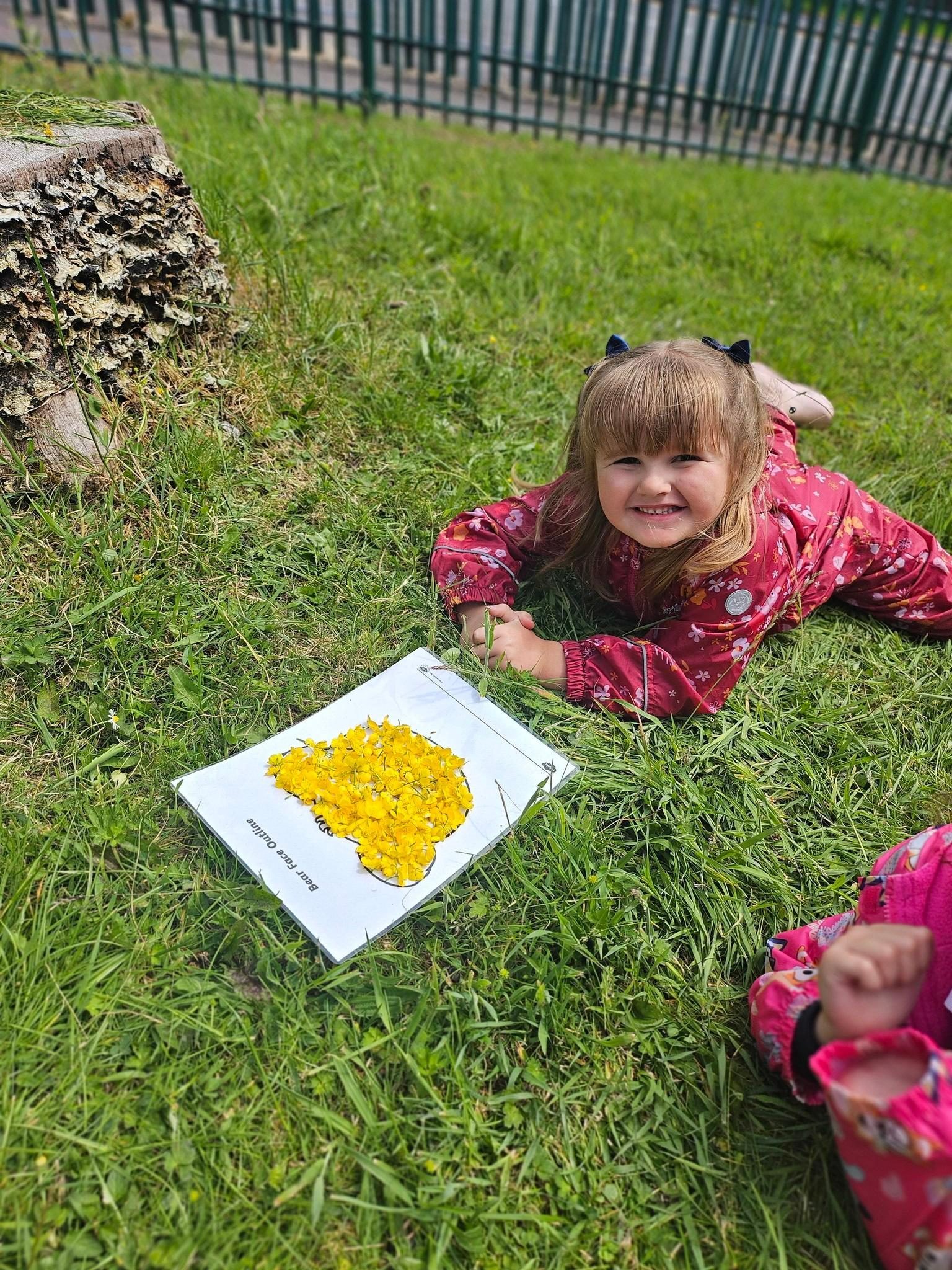 Pupil creating a nature artwork