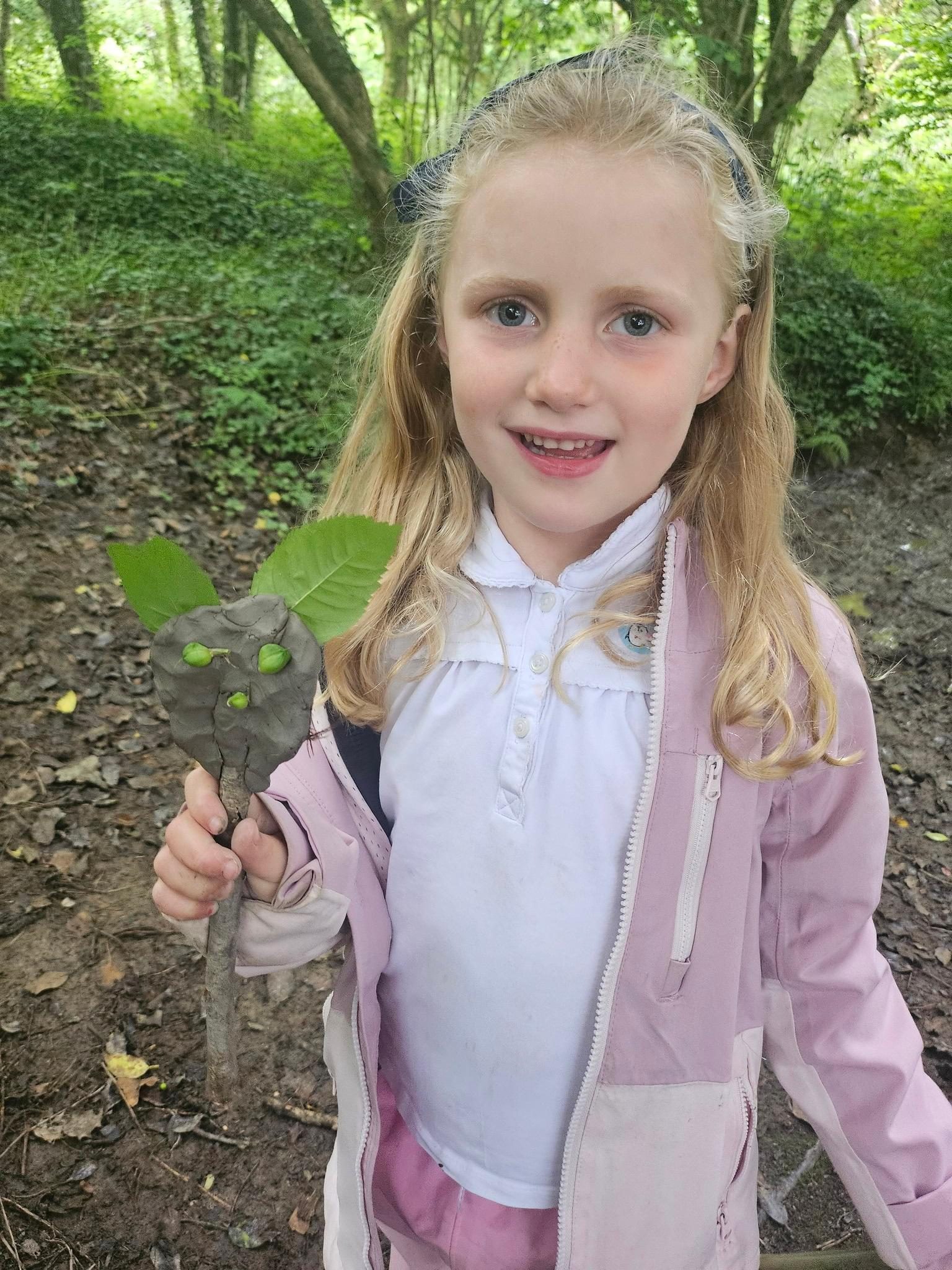Pupil making a woodland craft