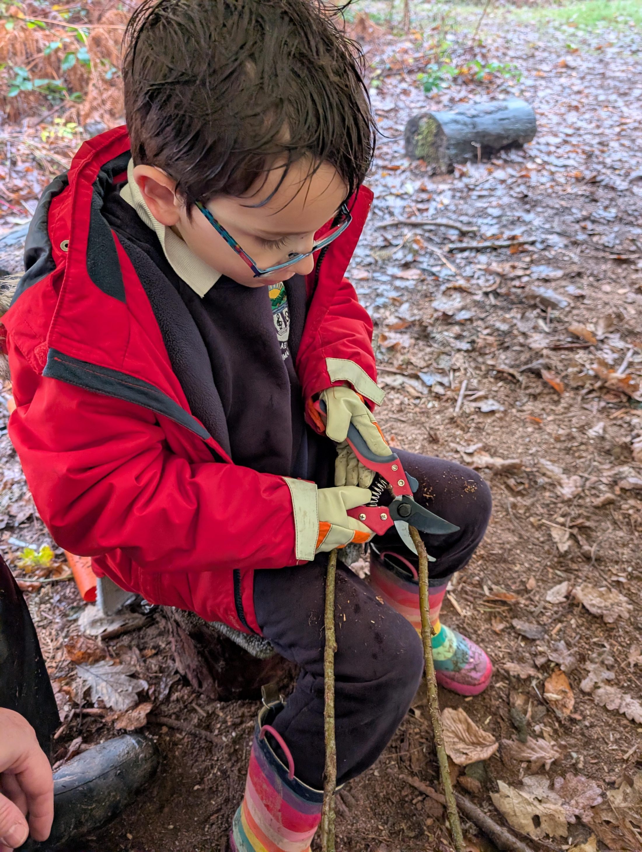 Pupil using tools during an outdoor activity