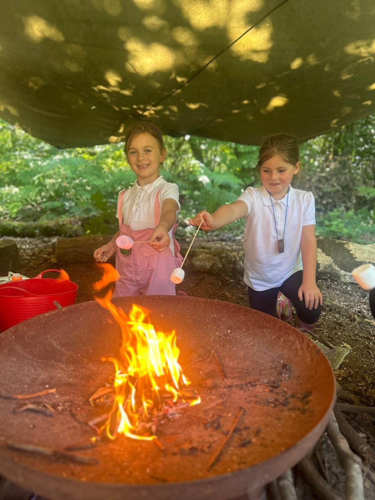 Pupils lighting a fire during a Forest School activity