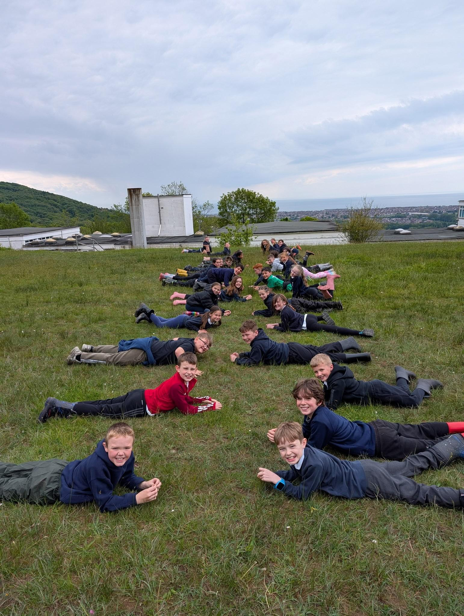 Pupils relaxing together on the school grounds